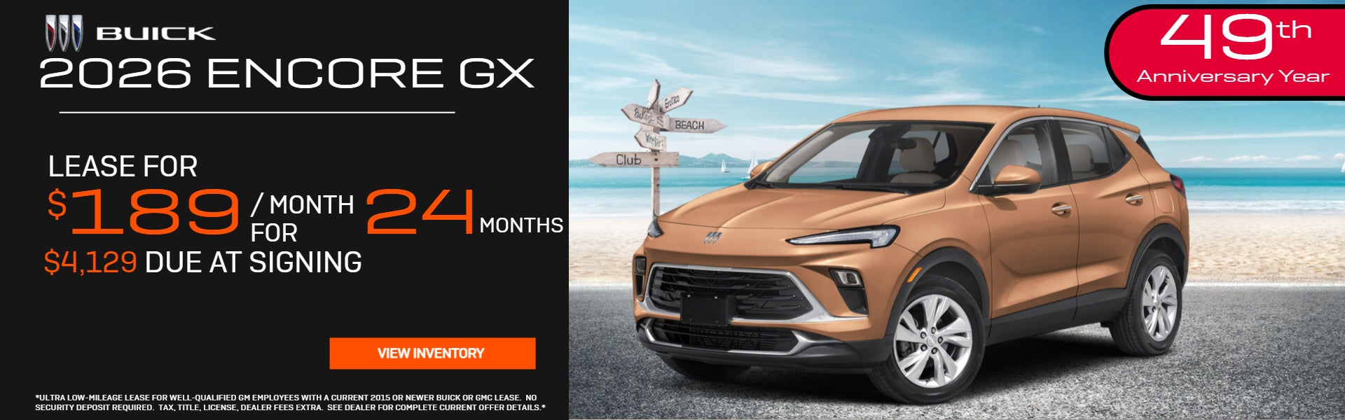 Orange 2026 Encore GX parked on beach